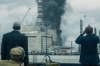 Three men stand in front of a burning nuclear power plant in 'Chernobyl.'